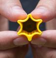 The one finger cutter has a blade on one end and the other looks like a star for easy identification.