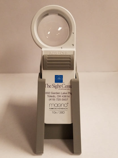 An Eschenbach stand holding a magnifier. Front view