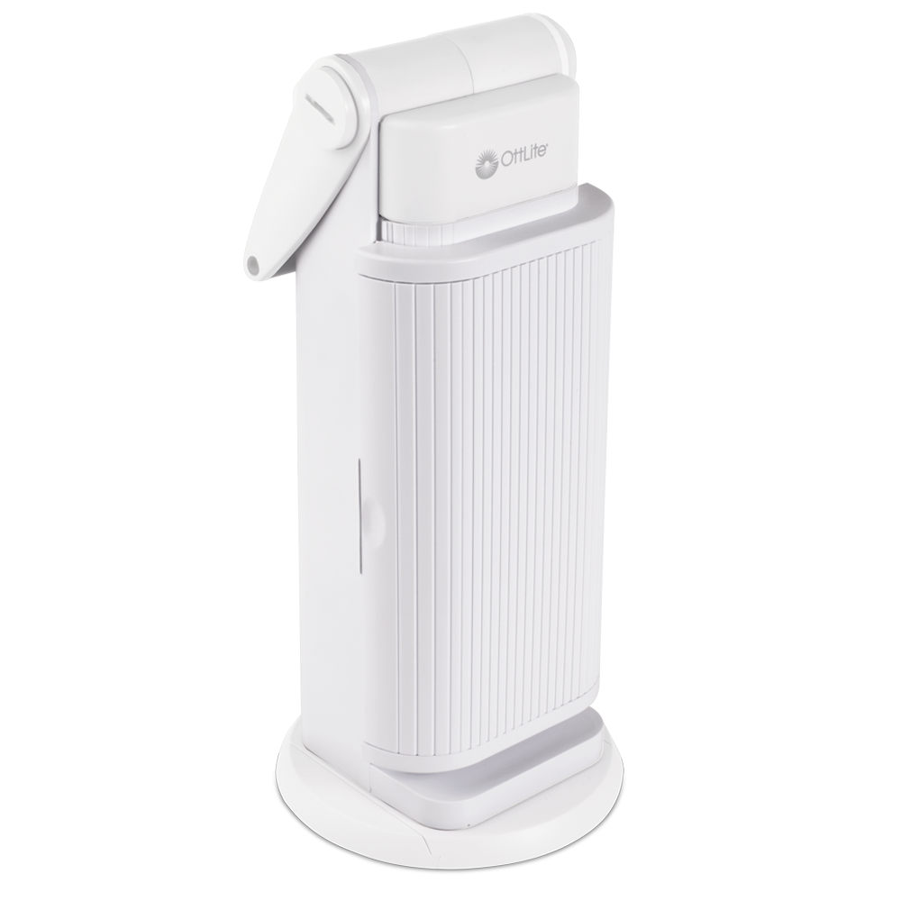A White lamp that can be carried around by the handle on top. The light part swings out and open however it is closed in this instance