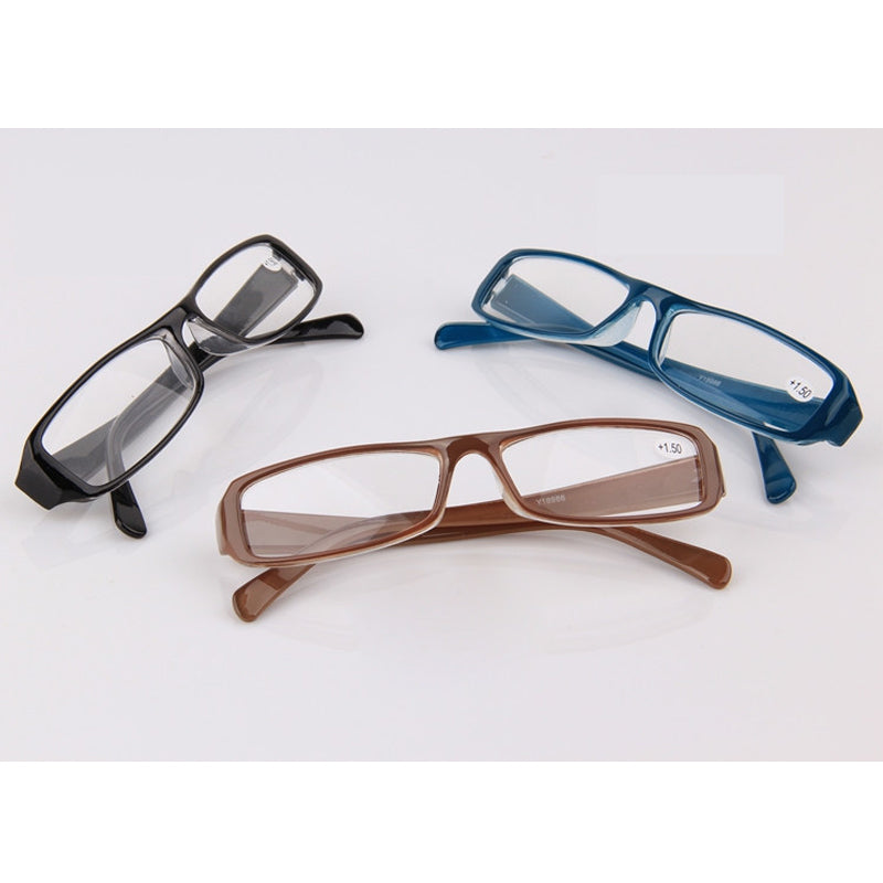 A variety of reading glasses. One has a black frmae, one has a blue frame and the last one has brown frames